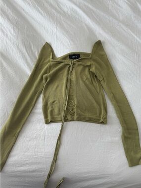 Green knitted long sleeve top with tie-up lace in and distressed details